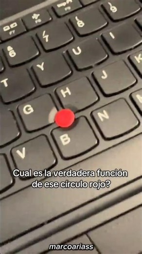 What is the purpose of the red dot on a laptop keyboard?