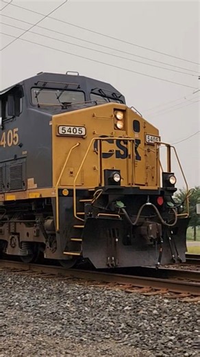 CSX Garbage Express M634 Passes across crossing with smoky haze from Canadian Wildfires July 15, 26