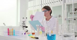 Female Scientist Reviews Documents Laboratory Setting Stock Footage Video (100% Royalty-free) 3725965721 | Shutterstock