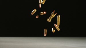 Download Bullets falling and bouncing in ultra slow motion 1,500 fps on a reflective surface - BULLETS PHANTOM 026 for free