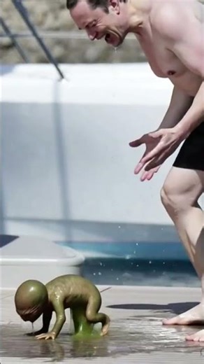 space man giving birth to an alien Baby.