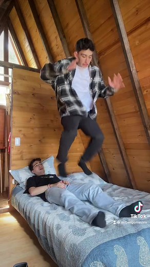 Playful Jumping Fun in a Rustic Attic Room