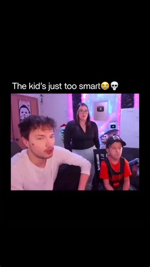 Real on Instagram: "Kid’s going places 🤣😭 This viral clip features a humorous, fast-paced debate between Larray (Larri Merrritt) and a woman over the classic “Boys vs. Girls” trope, with a young boy sitting between them as the ultimate “judge.” The man lists off male achievements—such as walking on the moon and inventing the lightbulb—to argue for “team boys.” The woman counters with the biological argument that women are the ones who give birth to all those men, seemingly winning the point wi
