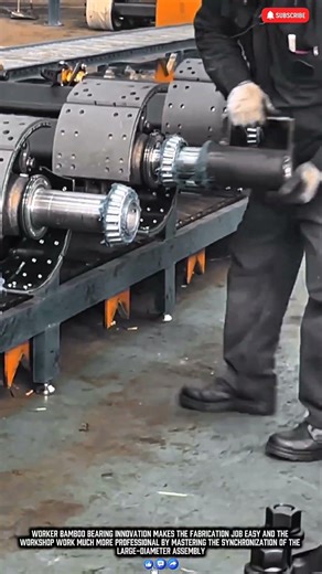 Worker assembling large bamboo bearings for stable mechanical system production results