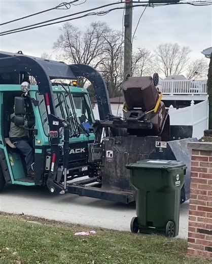 Garbage Truck Dumping Full Cart
