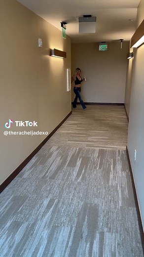 Woman in Black Crop Top Walking Confidently