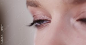 Beautiful Eyes of the Model Close Up. A Young Girl Looking into the Lens of a Movie Camera.