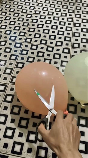 Experiment: Will a water balloon explode when it rolls down from...