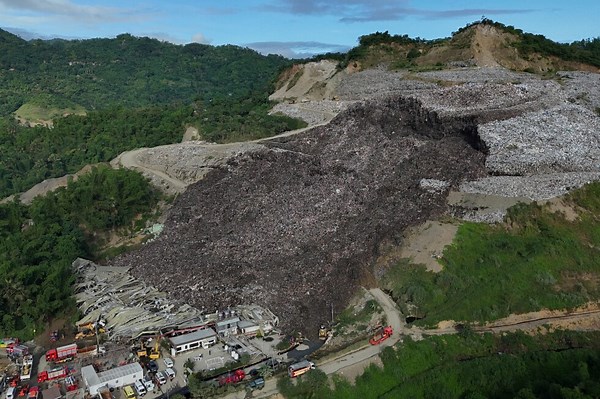 Mound of garbage collapses at Philippine landfill, killing 2 and leaving 36 others missing