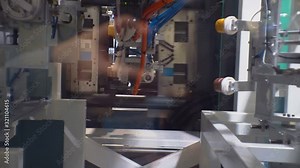 modern manufacturing industry.technological process.production of plastic ware.thermoplastic on an automated line produces plastic cups.close-up.shallow depth of field Stock Video