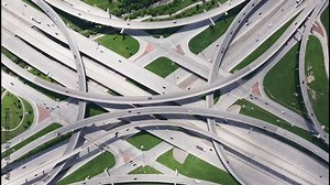 High Five interchange with traffic intersecting highway 75 and interstate 635 in Dallas, Texas - 4K Drone