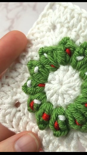 Embrace the holiday spirit with our Christmas Wreath Crochet Granny Square tutorial! 🎄Create festive squares for delightful decorations. Elevate your crochet game this season! #ChristmasWreath #GrannySquareCrochet #crochetlove #crochetchristmas | Crochet Bureau: patterns, tutorials