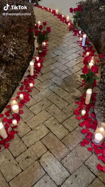 Romantic Surprise Proposal with Beautiful Flower Wall and Candlelight Setup