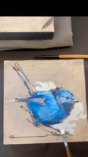 A vivid blue bird comes to life on a neutral canvas, its form sketched with energetic, dynamic lines. The striking blue hues contrast beautifully with the subtle background, drawing immediate attention to the bird’s vibrant plumage. The use of bold brushstrokes adds texture and movement, suggesting a sense of liveliness and spontaneity. The minimalistic approach to the background emphasizes the bird’s presence, creating a focal point that captures the essence of nature’s beauty. Via: @paolaportf