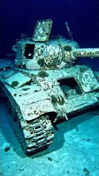 Salvaging sunken tanks from World War II.