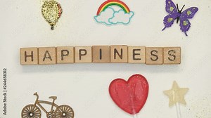Happiness word on cubes made by womans and childs hands, having fun together
