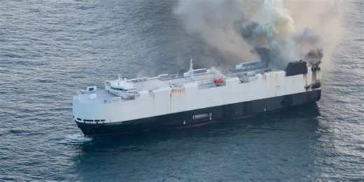 22 crew members rescued after fire breaks out on cargo ship carrying thousands of vehicles