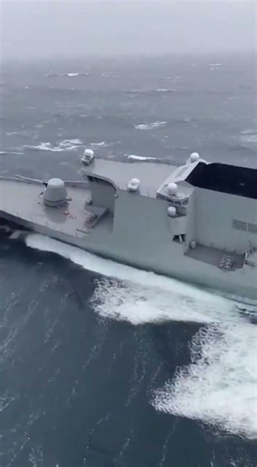 Battling the Storm: A Warship’s Rough Voyage at Sea 🌊
