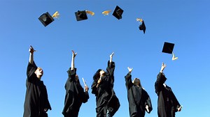 Download Group of graduates throwing graduation caps for free