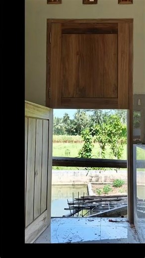 installation of cowboy-style doors #contruction #house #worker #teakwood #building