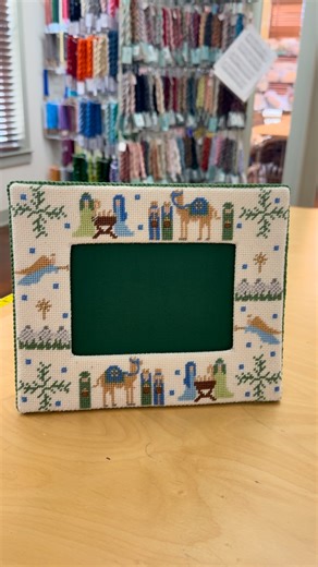 ✨ Finishing Friday ✨ How cute is this stitched frame made by one of our customers? Frames make for such functional (and beautiful!) finished products! This one would be perfect for displaying a favorite Christmas card each year. #finishingfriday | The Needle Works