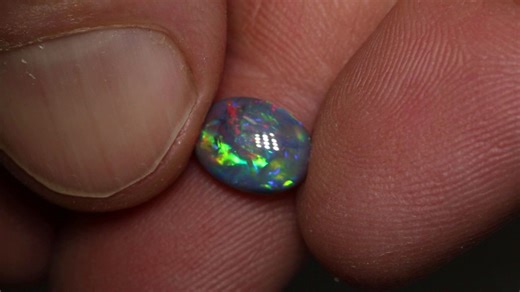 15K views · 555 reactions | We love a black opal with that red and blue color combo! This vibrant Lightning Ridge gem is a stunning blend of colours and patterns that radiate across the face of the opal. Perfect for a ring setting.✨️ https://blackopaldirect.com/products/1-72-ct-black-opal-9-9x7-3x3-8mm | Black Opal Direct | Facebook