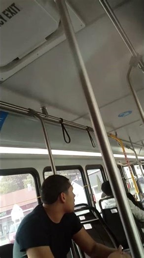 the bus driver is explaining how to open a door to New Yorkers