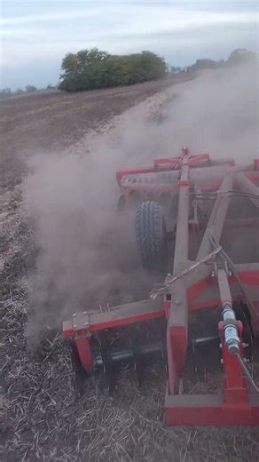 John deere 4020 disking wheat field