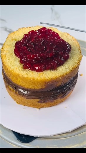 How to Build a Layered Cake - Completely Delicious Assembling a layer cake is the process of stacking leveled cake rounds with filling (like frosting, jam, or cream) in between, securing them, and then applying a final coat of frosting for decoration, often using tools like a turntable and spatula for neatness. Key steps include leveling cakes, creating a "glue" of frosting to secure the first layer, spreading even filling layers (often with a buttercream dam for runny fillings), stacking upside