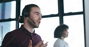 Call center, consulting and conversation with man in office for communication, contact us and customer service. Help desk, technical support and telemarketing with male employee for sales advisor