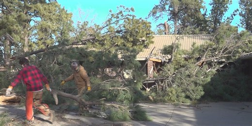 Rapid City family helps neighbor clear out house debris in windstorm aftermath