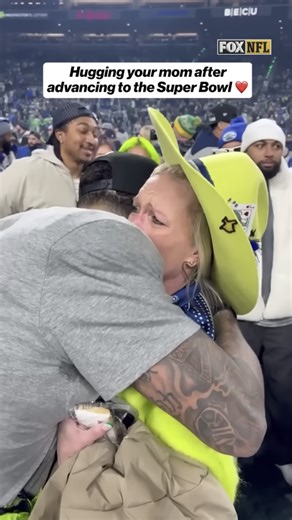 A priceless moment: Jaxon Smith-Njigba shares an emotional hug with his mom