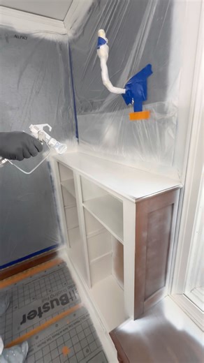 Applying BIN primer to these bookshelves. Results at the end