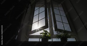Open window sunlight. Sunshine streaming through an open window. Slow motion. Cinematic video of open window on sunny day. Clean, fresh air and unwind instantly. Home sweet home. Apartments