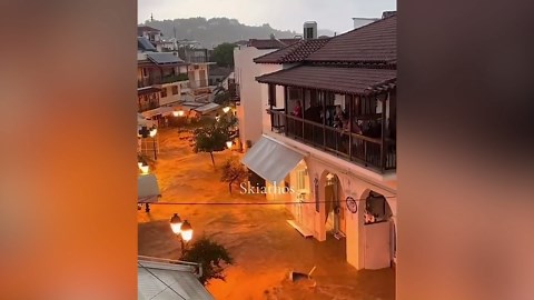 Flood water gushes down Skiathos road as intense rain hits Greece