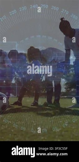 Vertical video: Coach tapping shoulder, players aligning behind ball for sports drill, HUD overlay. Soccer, teamwork, mentoring, field, outdoor, lowangle, vertical video Stock Video Footage - Alamy