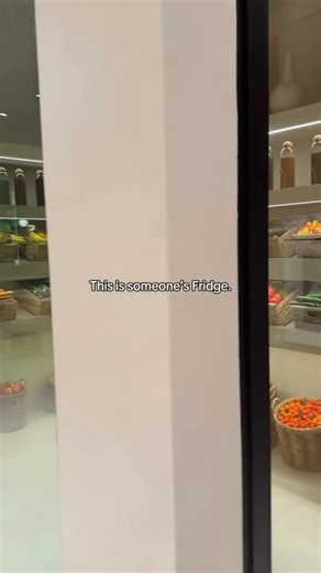 Divine Design Decor on Instagram: "Wish I had this when my kids were younger…🍎 🥒 🍊Via • @vidinine Walk-in cold gallery 📹 by @noy_tawil1 🤝 with @mlrdevelopment The produce is curated like collectible art and every bottle rests under soft architectural lighting. The kind of space that exists behind the walls of homes in Bel-Air, Notting Hill, and the hills above Lake Geneva. Custom-designed with multi-zone cooling, integrated humidity control, and museum-grade shelving, this level of refriger