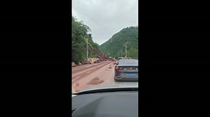 China: Dramatic Moment Huge Rocks From Landslide Crash Onto Mountain Road