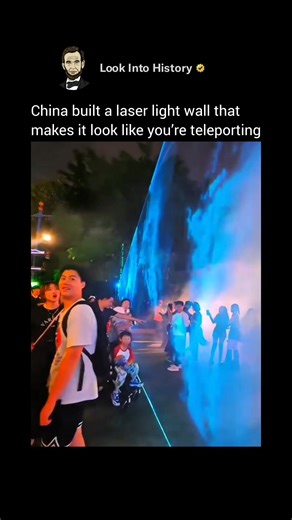 Look Into History on Instagram: "The “laser light wall” in China is real but it’s not a solid wall. 💡✨ It’s made using high-powered laser projectors arranged in rows, often combined with mist, water fountains, or building surfaces to make the beams visible, creating the illusion of a glowing wall in the sky. These shows are common in big cities like Shanghai, Guangzhou, and Shenzhen, especially during national celebrations, New Year festivals, or tourist events. Waterfronts, skyscrapers,