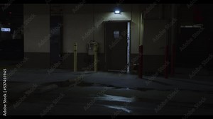 Scary and spooky dark alley and door in city at night