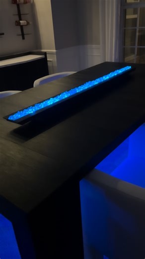 Kendra Davis on Instagram: "💙DIY LED Table Light💙 Hey-hey L💜VES! I am in loooove with the way this table light turned out 🥰🥰. 💙 I started out with 8 of the 4.75” wooden boxes from Dollar Tree. I used wood glue to attach them together. 💙 I cut a 1”x .5”x8’ down to 50”…cutting the ends at a 45° angle. ‼️Note‼️:The 8 wooden boxes do not equal the length of the 50” pieces of wood, so I cut a wooden plaque from Dollar Tree, to fill in the gap and to create ends (to hold the acrylic gems). 💙 I