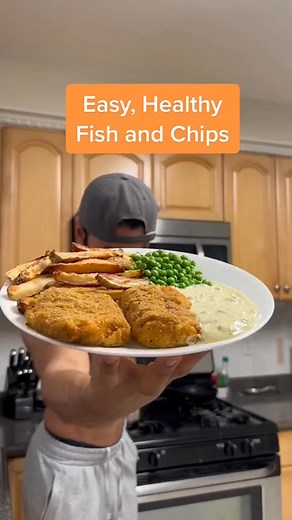 Easy, Healthy Fish and Chips with a quick Tartar Sauce. Low calorie, packed with protein, and SO tasty. - Chips: 2 medium Potatoes (approx. 300g total) 1 tsp Olive Oil Season with Salt, Garlic Powder, and Onion Powder - Fish: 2 Fish Fillets (I use Cod, but you can also use Haddock, Halibut, Cod, Pollock, or Salmon) 1/2 cup Panko Bread Crumbs (or Corn Flakes) Season with Salt, Pepper, Garlic Powder, Paprika, and Thyme 1 Whole Egg 1 tsp Mustard Optional: A Spray/Glaze of Olive Oil for Fish before 