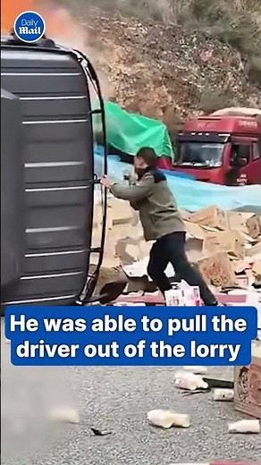 Dramatic moment hero saves driver from a FIERY blaze