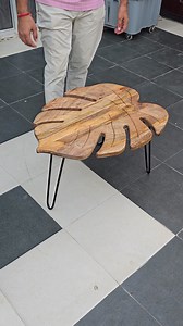 ✨ When furniture becomes art. Our Leaf-Shaped Coffee Table is handcrafted from rich mango wood 🍂 and set on sleek iron legs for strength & style. Every curve reflects nature’s elegance 🌿, making it not just a table but a luxury statement piece. Perfect for coffee, décor, or conversations that matter. 👉 Transform your living space with timeless sophistication. | Woodlas