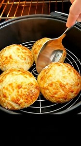 If you mix️ cheese, milk, flour, and baking powder, make patties out of the dough, air fry them for 6-8 mins, flipping halfway... you get easy Homemade Cheese Biscuits (cheese scones) that are fluffy and airy inside with slightly crispy exterior. I split them open with an extra pat of butter or jam. Cozy, cheesy, and way too easy—basically my new favorite excuse to skip store-bought bread. Recipe in comment❤❤👇 | Air Fryer: Easy Recipes
