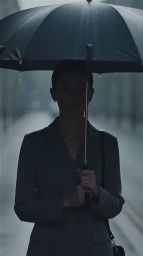 A person walking alone with an umbrella