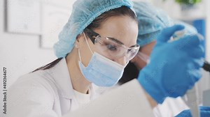 laboratory dispenser pipette african american pipette in hand study