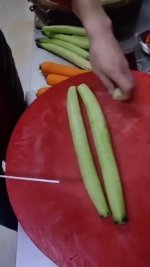 Slicing Fresh Cucumbers in the Kitchen