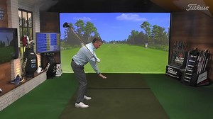 Danny has a beautiful golf swing, but just like you, he stands taller at impact than he does at address. Backing out of the shot like Danny can be problematic. To stop backing out of shots, take your club, and hold it across your chest. Turn your shoulders so the club points down to the ground. When your shoulders turn on an angle, you can maintain your height in the backswing. In the downswing, turn your chest so it points down to the ground, not up to the sky. Pointing your chest down to the g