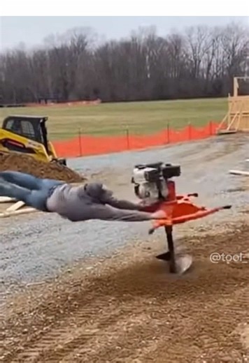 Post hole digger takes man for a wild ride! #construction #tools #funny #bluecollar #trades